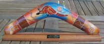 Aboriginal art corporate boomerangs with logo on stand